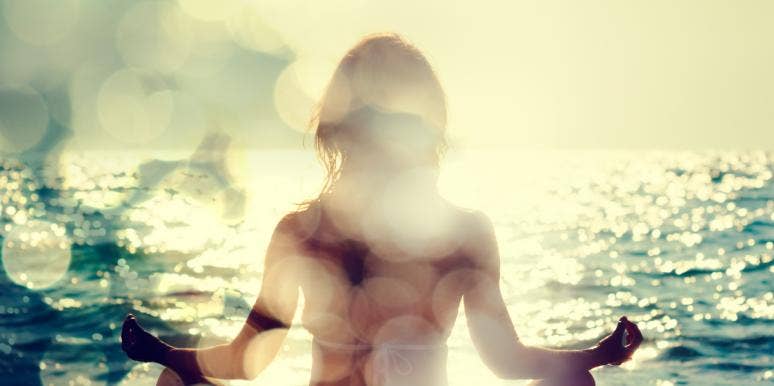 How To Open Your Third Eye To Navigate Life woman meditating by ocean