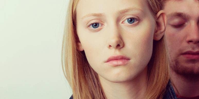 how to safeguard your relationship sad looking woman with man behind her