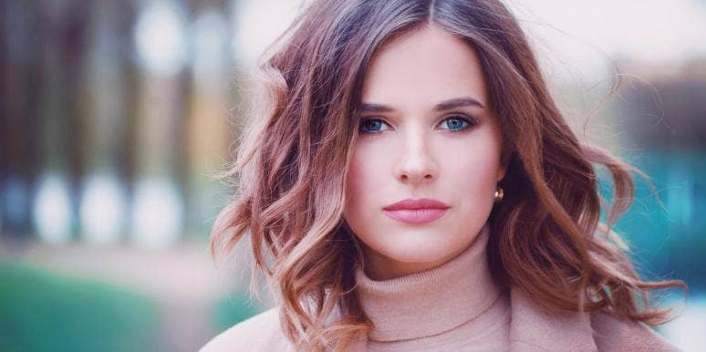 how to stop being a perfectionist smiling woman in a turtleneck