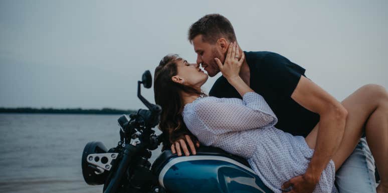 How To Tell If A Guy Is Falling For You (Or Not) By Reading His Body Language couple leaning over and kissing