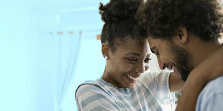 How To Write A Love Letter At Any Stage Of Your Relationship couple hugging after learning how to write a love letter