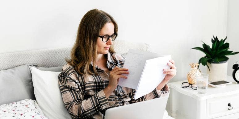 How To Write A Good Resume That Gets You The Job woman working from home in bed