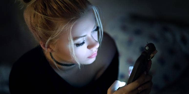I Broke Up With My Boyfriend Via Text And I Don’t Regret It girl on phone in dark
