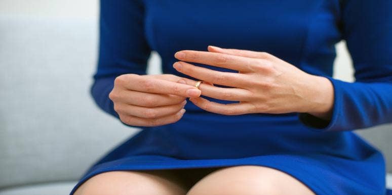 Why Fantasizing About Divorce Isn't Necessarily A BAD Thing woman taking ring off
