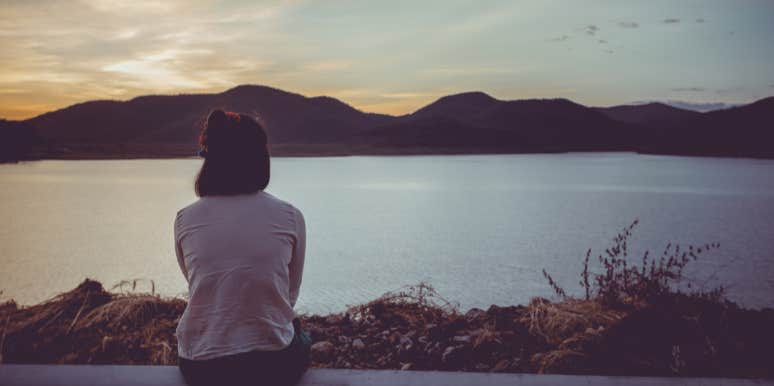 Why The Only Way To Move On Is To Find Yourself woman sitting by lake