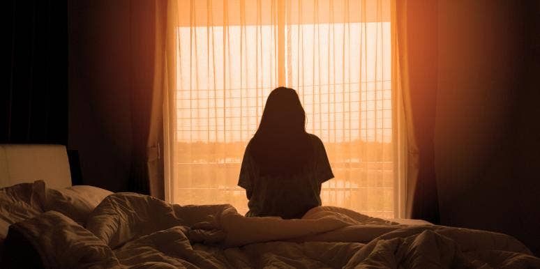 Things Changed After Saying 'I Love You' — It Destroyed Our Relationship sad woman at window back turned