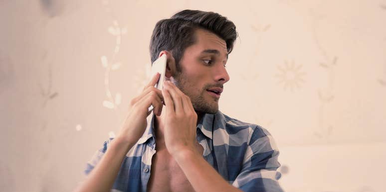 If A Guy Shows These 12 Signs, He Will Likely Break Your Heart man on his phone, looking to the side