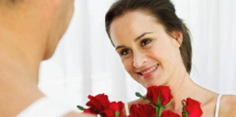 Why Women Shouldn't Say "I Love You" First man woman flowers