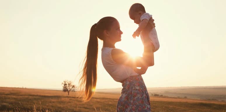 I'm A Single Mom By Choice — But I'll No Longer Be A Martyr woman holding baby