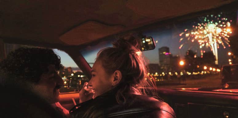 Couple in car watching fireworks 
