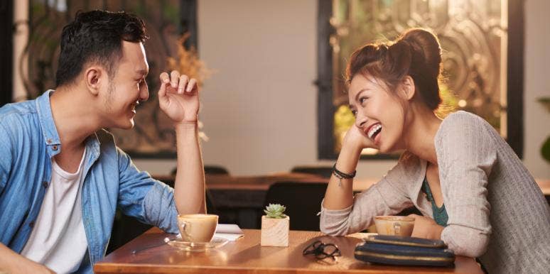 The Most Important 60 Seconds In Any Relationship couple laughing at the table