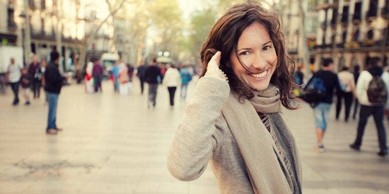 imposter syndrome smiling woman in a scarf and sweater