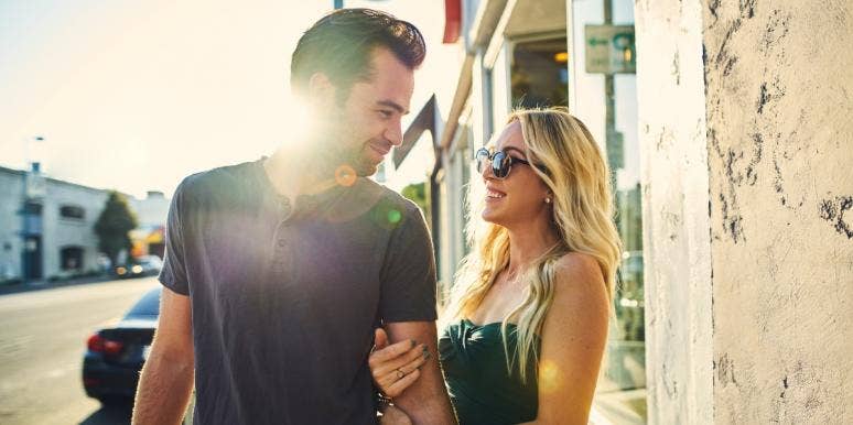 INFP Relationships, Compatibility & Love Matches With Other Personality Types couple smiling at each other on the street