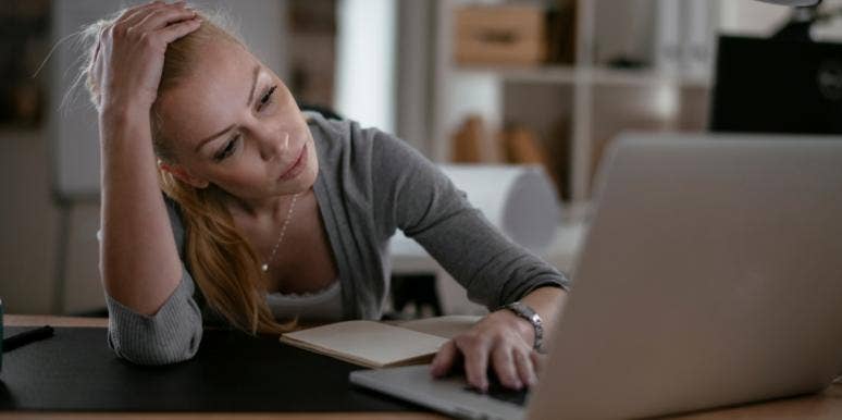 Internet Trolls Called Me a Psycho For Sharing My Love Story, But I Won't Let Them Win unhappy woman at computer