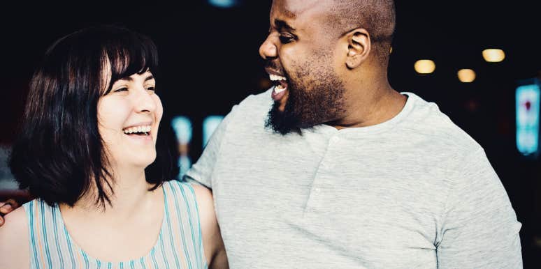 How to help interracial relationships thrive Mixed-race couple smiling and laughing together