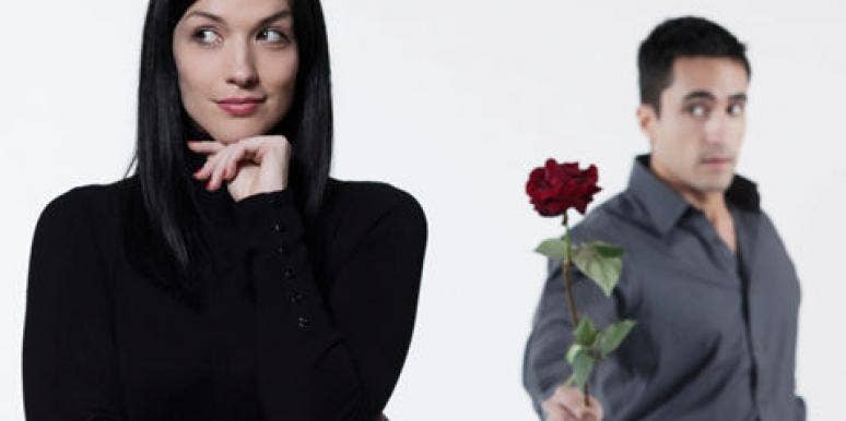 Hard To Get: Does It Work? man offering rose to woman