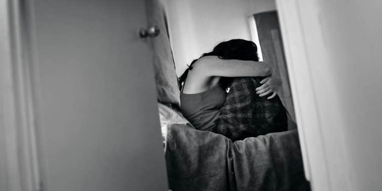 It's Not Her Fault: Why We Should Be Teaching Guys Not To Rape woman crying on bed