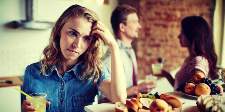 My Friend Tried To Make A Move On My Husband — Until I Caught Her woman looking annoyed while couple chats
