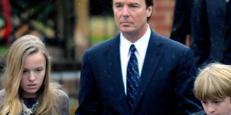 John Edwards with his children Emma Claire and Jack at Elizabeth Edwards' funera