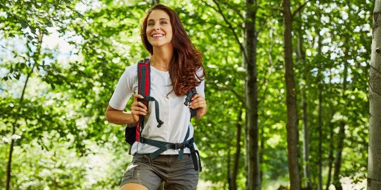 karmic lesson happy woman hiking
