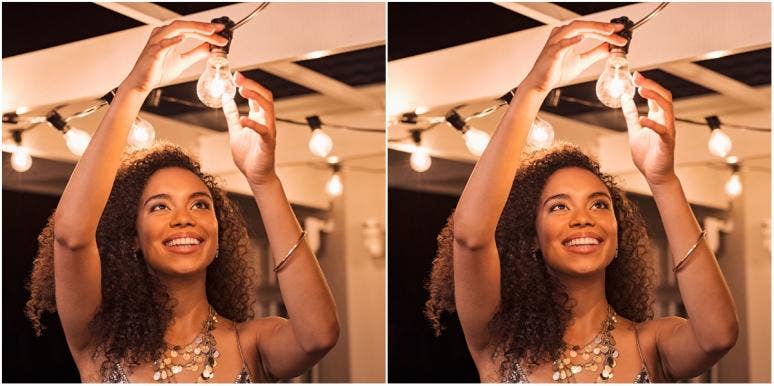 key to success in life woman turning on a light bulb