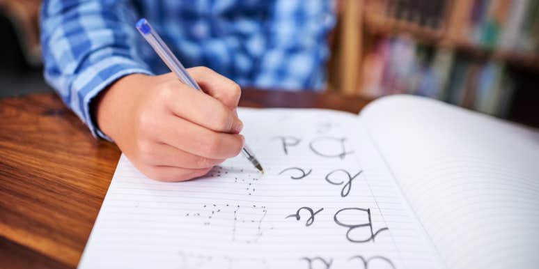 child practicing handwriting