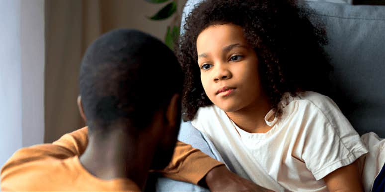 how to talk to kids about parents cheating grade-school aged girl watches her dad, whose head is to the camera