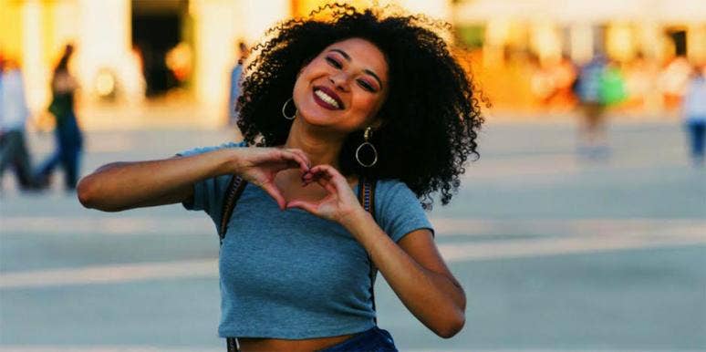 ISTJ Meaning & 16 Prominent Personality Traits woman holding hands in heart symbol