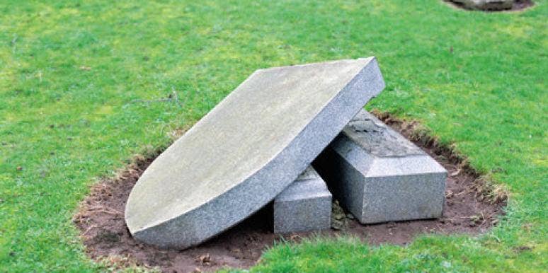 knocked down tombstone