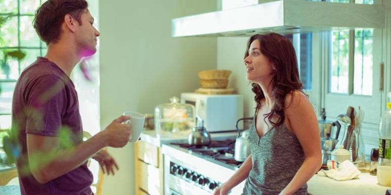 lack of communication in a relationship man and woman talking in a kitchen