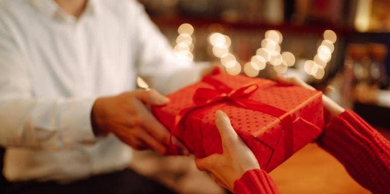 person giving gift box