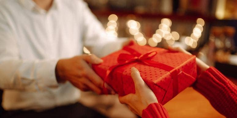 The Best Last Minute Christmas Gifts person giving gift box
