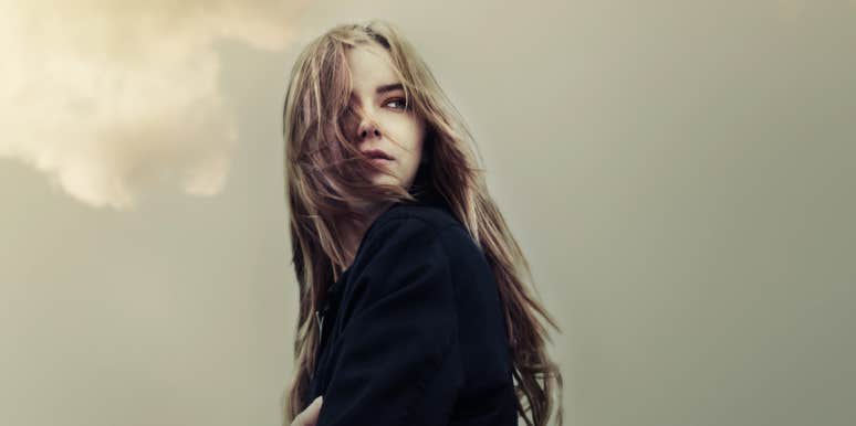 Types of lesser-known abuse woman against a grey sky