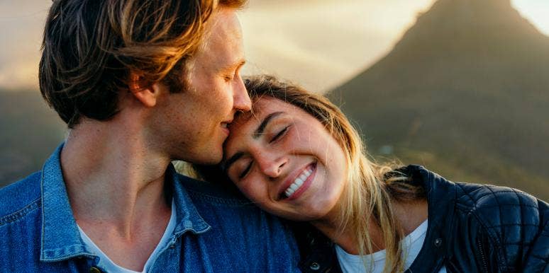 Libra And Libra Compatibility: What Happens When Two Libras Date man kissing woman on the head
