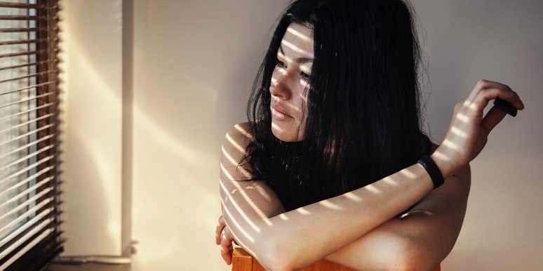 12 Signs You Have A Lone Wolf Personality loner woman looking out the window