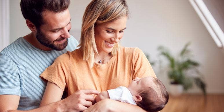 Losing Friends to Parenthood parents holding baby