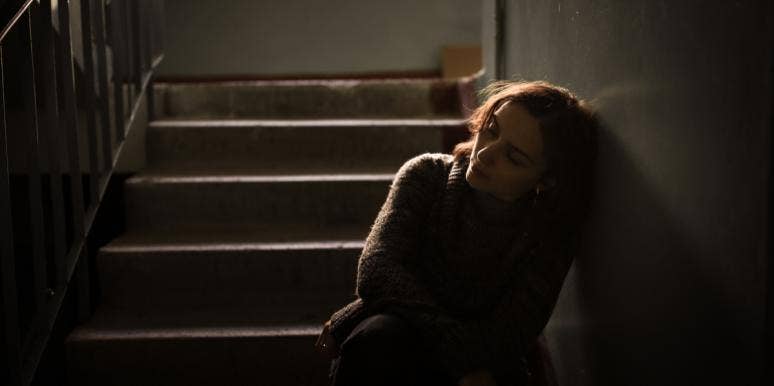 Why Being Raped Forced Me To Lose More Than Just My Virginity sad woman on stairs