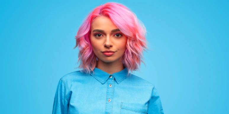Why Love Isn’t Worth It If You're Not Truly Happy blue background woman in blue shirt pink hair