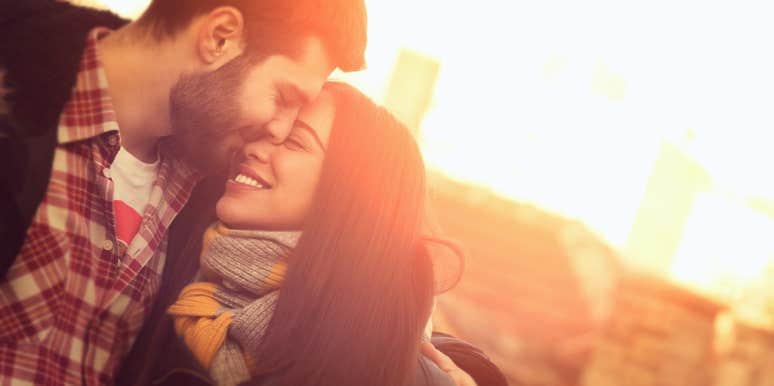 couples embracing in sunset