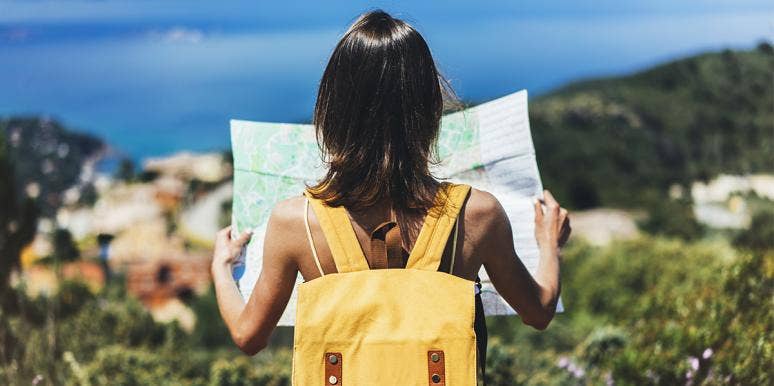 No, Loving To Travel Isn't Classism woman looking at map