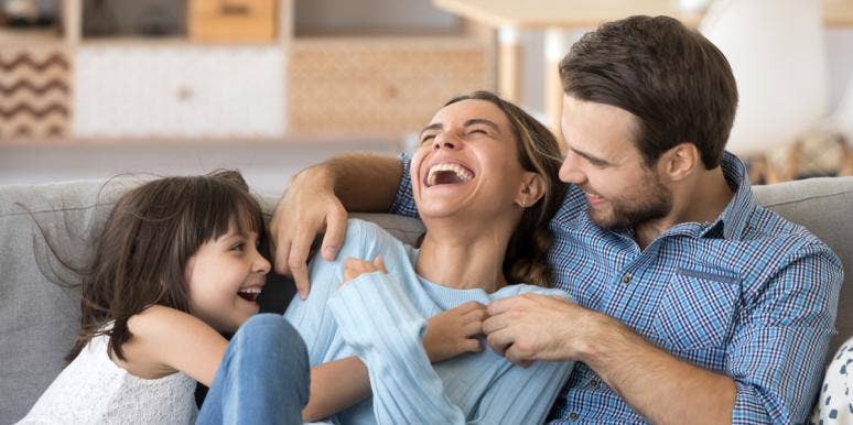 6 Loving Ways To Have A Truly Happy Marriage (And Happy Kids, Too) family together on couch