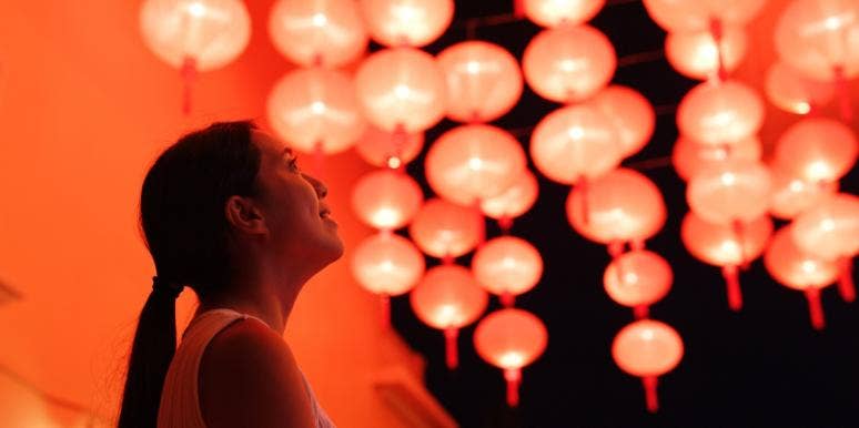 woman looking at chinese lanterns