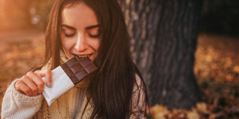 This Magical Chocolate Will Instantly Cure Your Period Cramps woman eating chocolate