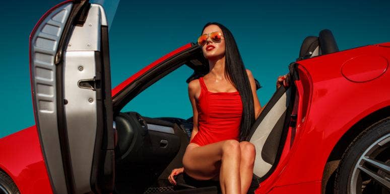 Why Women Are Selfish Lovers woman in red sports car
