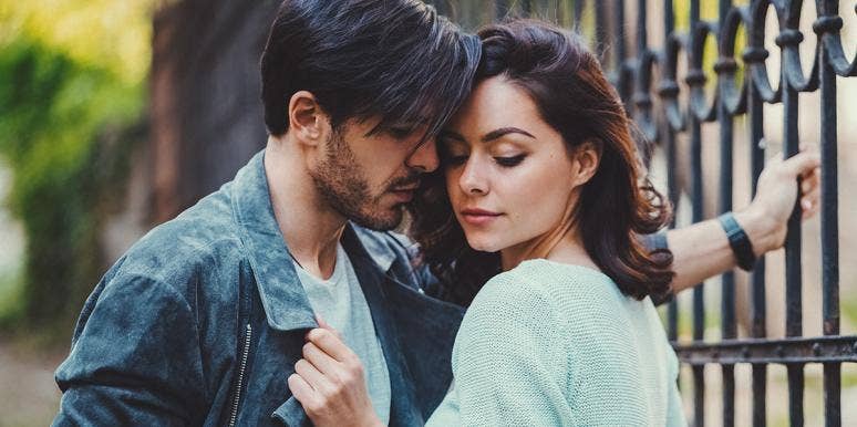 I'm Addicted To Male Attention, And I'll Do Anything To Get A Fix woman gripping man's jean jacket