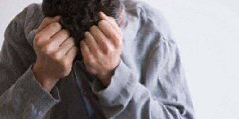 Man with his head in his hands Man with his head in his hands