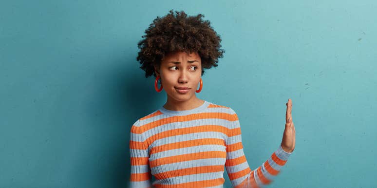 A Man Tried To Force Me Into A Relationship Because I Greeted Him woman with refusal gesture