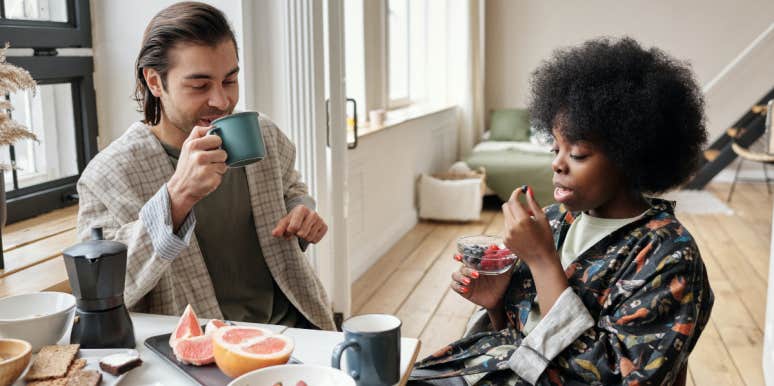 Man and woman eating breakfast together