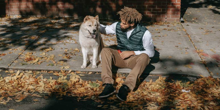 Man Calls his 5-Month Pregnant Fiancée ‘Heartless’ After She Refuses To Search For His Dog That Runs Away Regularly Man with dog sitting on sidewalk