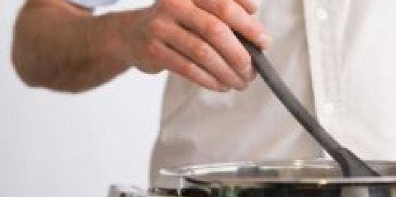 Is A Man Who Cooks The Ultimate Turn On? man stirring pot on stove